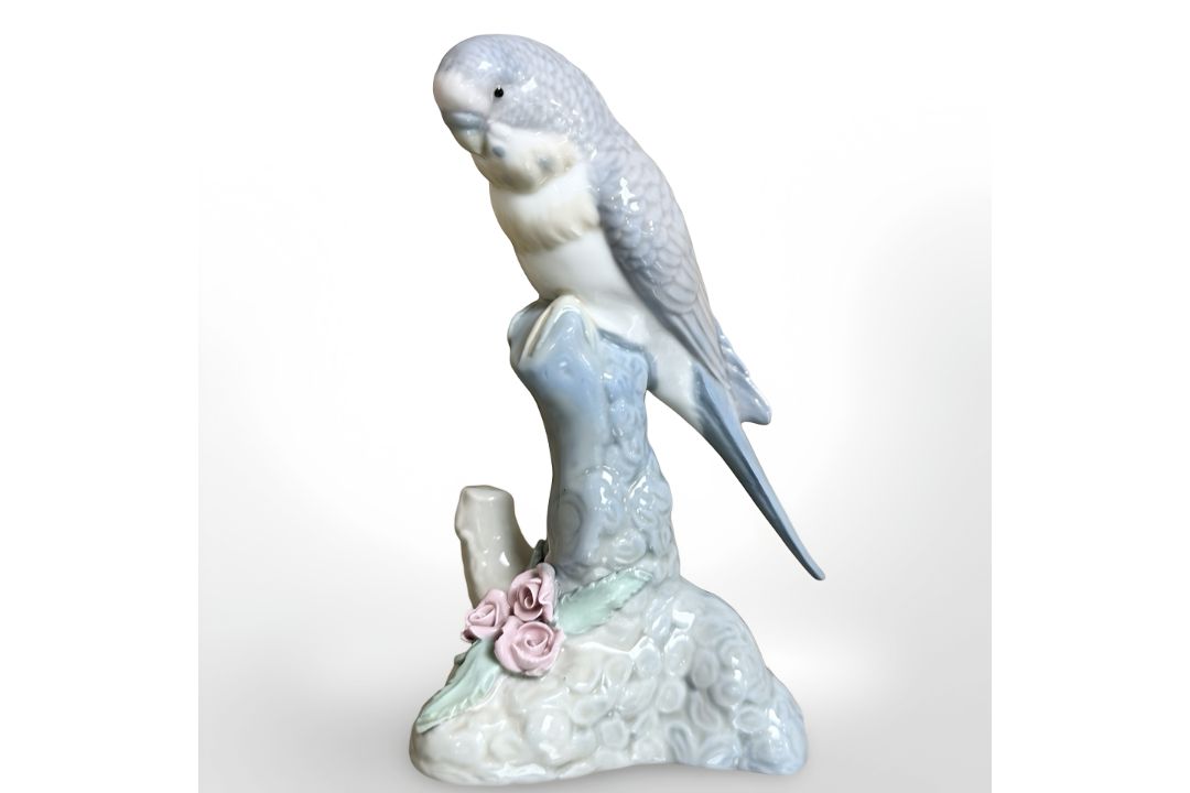 A Spanish figure of a parakeet on plinth, height 15.5 cm.