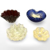 Four continental glass dishes, largest diameter 16 cm.