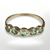 A 14ct yellow gold five stone emerald ring, size M. CONDITION REPORT: 1.5g.