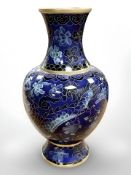 A cloisonne enamelled vase on blue ground,