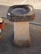 A stone birdbath 64 x 37
