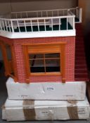 A corner shop and boxed part 2 first floor and roof plus a boxed Tudor top of house dolls house