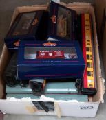 A box of '00' gauge coaches including 3 boxed Bachmann goods wagons