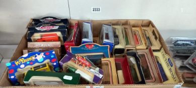 A large box of mixed Lledo model vans