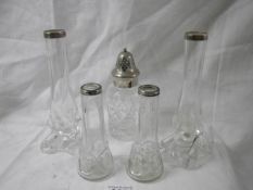 Two pairs of silver topped vases and a silver topped sugar sifter.