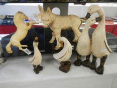 A quantity of duck figures.