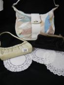 A shoulder bag and two evening bags.