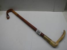 A good leather bone handled horse crop.