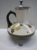 A Royal Doulton jug with hall marked silver top, (hairline crack to jug).