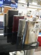 A quantity of spirit flasks.