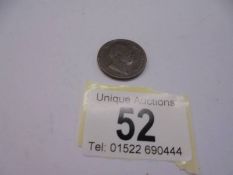 An 1831 King George IV farthing.