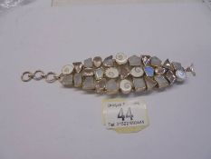 A silver stone set three row bracelet.