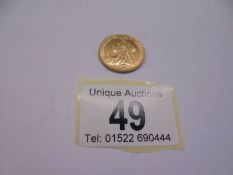 An 1899 Queen Victoria full gold sovereign.