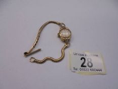 A 9ct gold ladies wrist watch, total weight 16.5 grams.