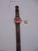 A vintage Omega Automatic Seamaster gent's wrist watch with red dial.
