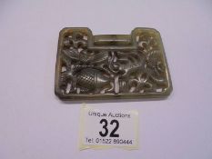 A Chinese jade lock shaped carved pendant depicting fish, 92 x 67 x 6 mm.