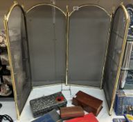 A brass plated & black mesh 4 fold fire screen