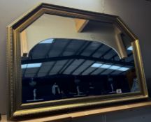 A large gilt framed mirror