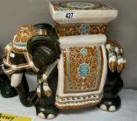 A large pottery elephant garden stool / plant stand