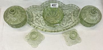 A vintage green glass dressing table set