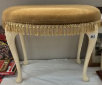 A vintage dressing table stool