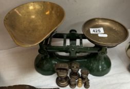 A pair of cast iron kitchen scales with brass pans