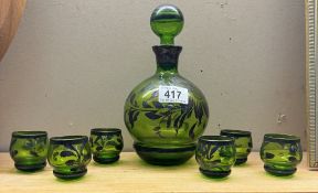 A vintage overlaid green glass decanter & 6 shot glasses