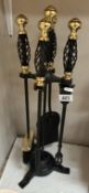 An iron fire place companion set