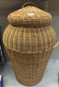 A large Ali-Baba style wicker laundry basket