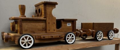 A large wooden pull along train & trailer. Total length 105cm