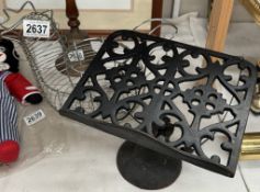 A cast iron cook book rest & chicken egg basket