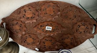 A hand carved wood tray