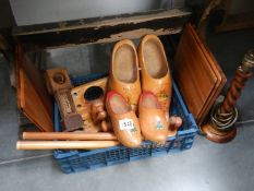 A box of wooden items including clogs.