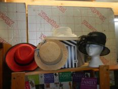 A quantity of vintage ladies hats.