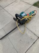 A Black & Decker hedge trimmer, tested & working.