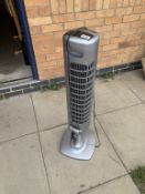 An Airforce tower fan with remote control unit