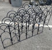 Two sections of trellis with plant pot holders