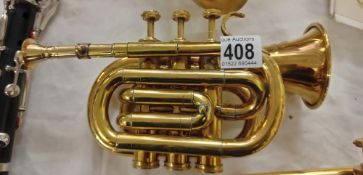 A small brass pocket trumpet