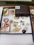 A mixed lot of brooches and other costume jewellery