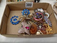 A good lot of costume brooches