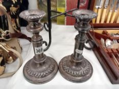 A pair of old Sheffield plate candlesticks