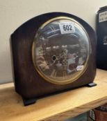 An Edwardian oak mantle clock