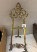 A brass easel. Height approximately 47cm