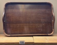 An Edwardian oak serving tray with copper corners