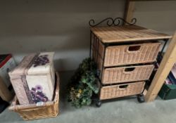 A 3 drawer wicker basket on wheels, wicker basket, quantity of canvas of fruit, & a Christmas wreath