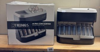 A boxed ultra coin sorter
