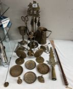 A good selection of brassware including companion set, spear, finial etc