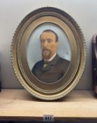 An Edwardian portrait in oval gilt frame