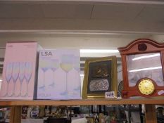 Two boxed sets of four glasses, a clock and one other item.