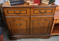 A mahogany effect two door cabinet. COLLECT ONLY.